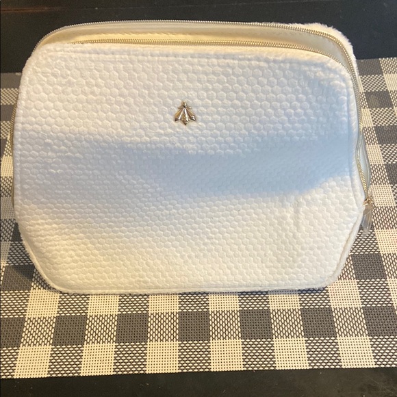 GUERLAIN Handbags - Guerlain White Quilted Cosmetic Bag with Metallic Logo